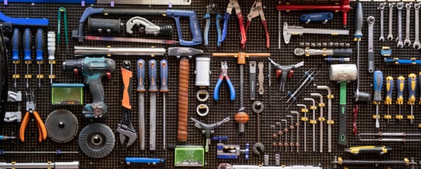 A wall of various tools, all lined up and waiting to be used again.